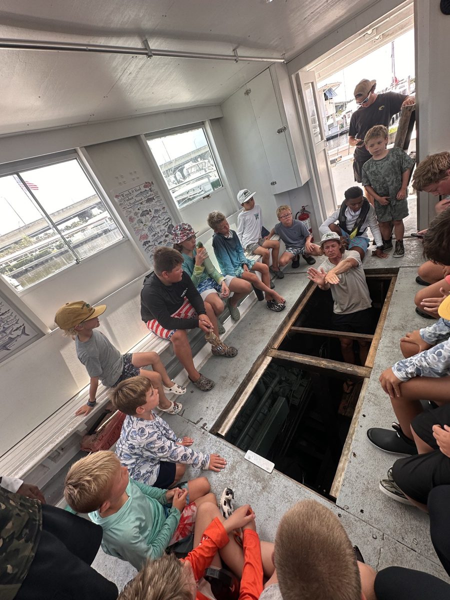 Campers looking into the head boat engine room