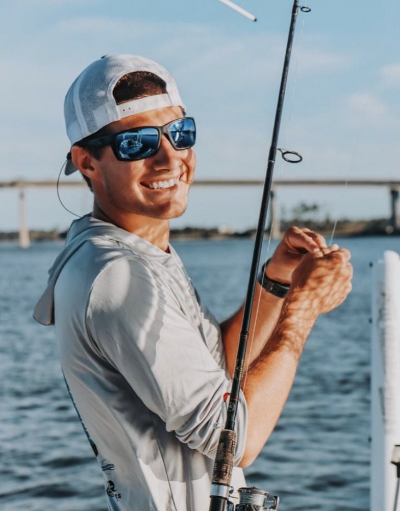 Capt. Carson Cook rigging a rod