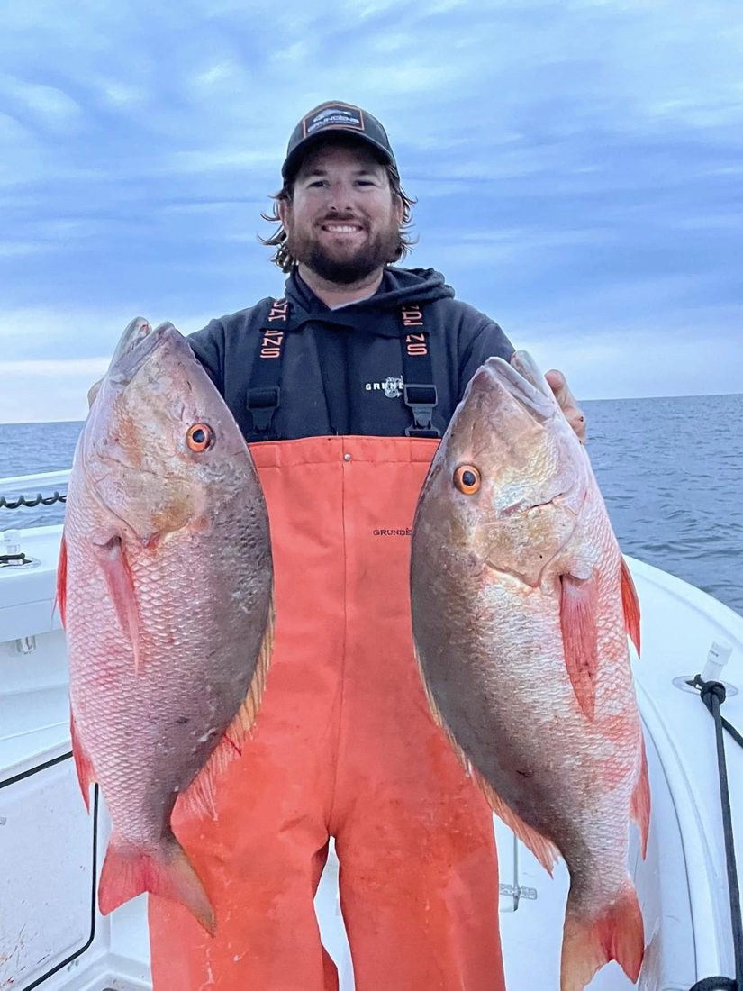 Capt. Joe Curtis with two mutton snapper offshore
