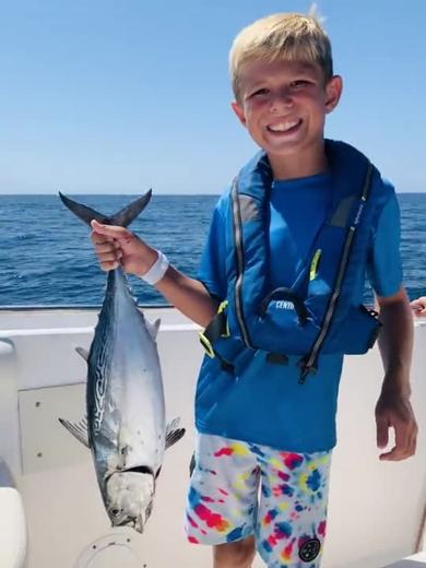 Camper holding a bonito