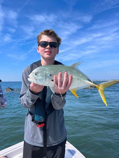 Camper holding a jack crevalle