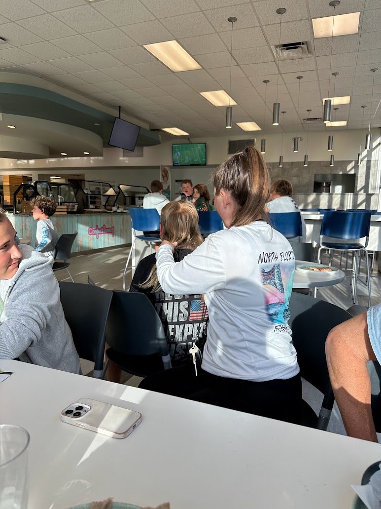 Co-director Katie Carraway with overnight campers in the Jacksonville University dining hall
