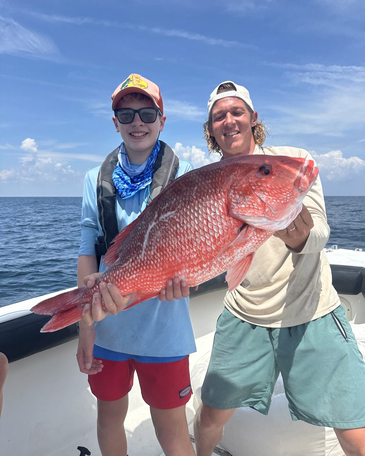 Two campers holding red snapper on the offshore day